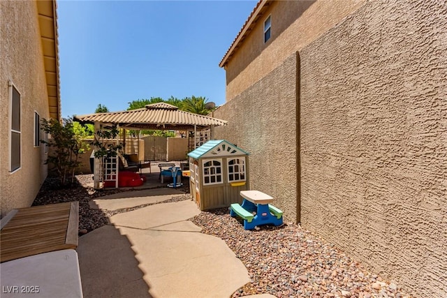 1761 Summerwood Cir, Henderson, NV 89012 - fenced backyard with a gazebo and a patio