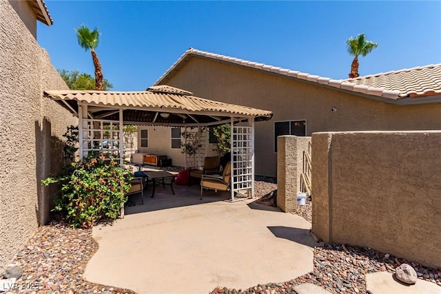 1761 Summerwood Cir, Henderson, NV 89012 - view of patio featuring a gazebo and an outdoor living space