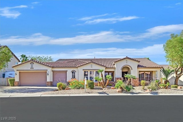 328 Hedgehope Dr, Las Vegas, NV 89183 - mediterranean / spanish home featuring stucco siding, an attached garage, driveway, and a tile roof