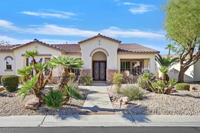 328 Hedgehope Dr, Las Vegas, NV 89183 - mediterranean / spanish home with stucco siding, a tiled roof, and stone siding
