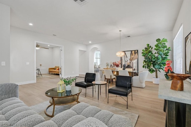 328 Hedgehope Dr, Las Vegas, NV 89183 - living room featuring arched walkways, light wood-type flooring, recessed lighting, and ceiling fan