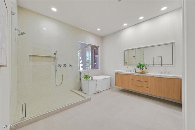328 Hedgehope Dr, Las Vegas, NV 89183 - full bathroom featuring tiled shower, a freestanding tub, double vanity, recessed lighting, and tile patterned floors