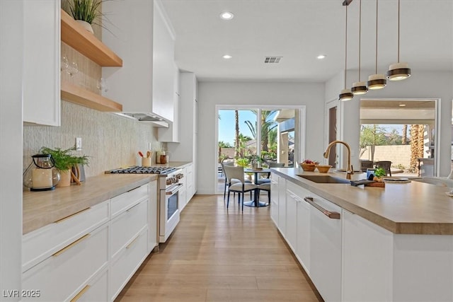 328 Hedgehope Dr, Las Vegas, NV 89183 - kitchen with white appliances, open shelves, plenty of natural light, white cabinetry, and recessed lighting