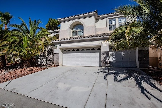 105 Chateau Whistler Ct, Las Vegas, NV 89148 - mediterranean / spanish house with a garage, stucco siding, concrete driveway, and a tile roof