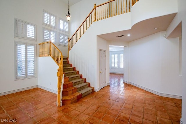 105 Chateau Whistler Ct, Las Vegas, NV 89148 - stairway with a towering ceiling and baseboards