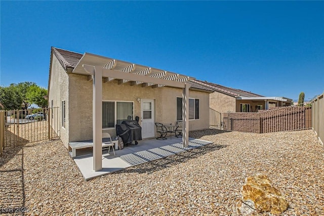 7717 Pine Warbler Way N, Las Vegas, NV 89084 - rear view of property with a pergola, stucco siding, a fenced backyard, and a patio area