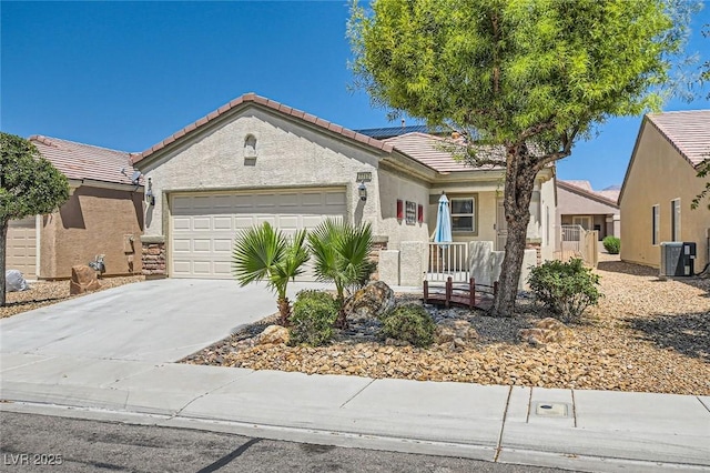 7717 Pine Warbler Way N, Las Vegas, NV 89084 - single story home featuring a tiled roof, an attached garage, roof mounted solar panels, concrete driveway, and stucco siding