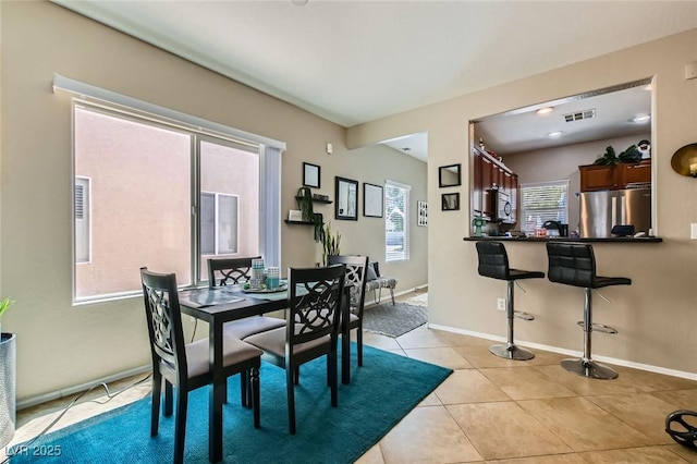 7717 Pine Warbler Way N, Las Vegas, NV 89084 - dining space featuring light tile patterned floors and baseboards