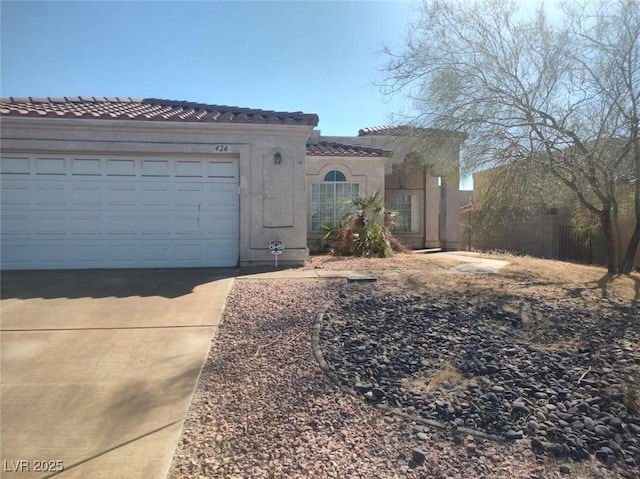 424 Wright Way, Henderson, NV 89015 - mediterranean / spanish-style house featuring a tile roof, concrete driveway, a garage, and stucco siding
