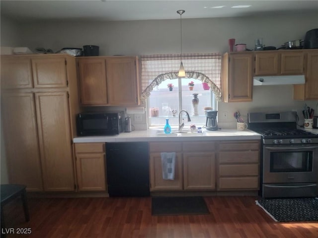 424 Wright Way, Henderson, NV 89015 - kitchen with black appliances, under cabinet range hood, dark wood finished floors, tile countertops, and decorative light fixtures