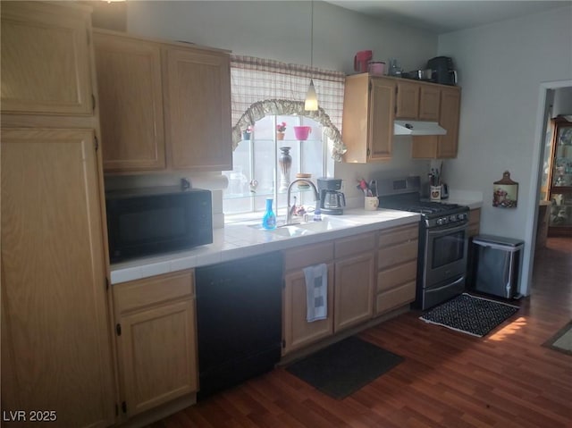 424 Wright Way, Henderson, NV 89015 - kitchen with stainless steel range with gas cooktop, black microwave, under cabinet range hood, and dark wood-type flooring