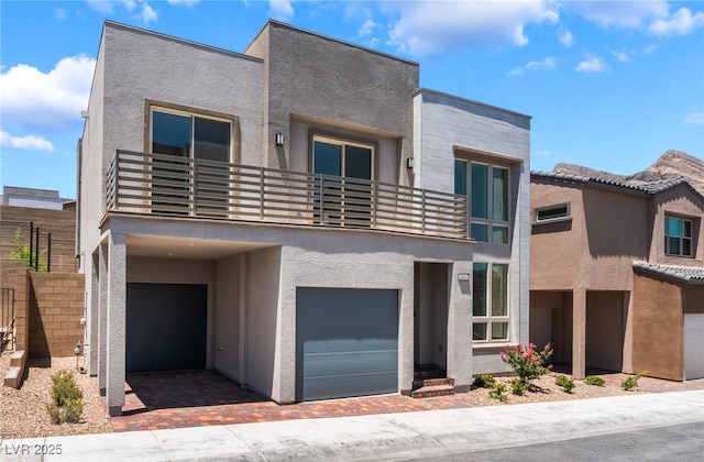 1801 Flycatch St, Las Vegas, NV 89138 - modern home with a balcony, stucco siding, and a garage