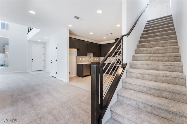 1801 Flycatch St, Las Vegas, NV 89138 - staircase featuring carpet flooring and recessed lighting