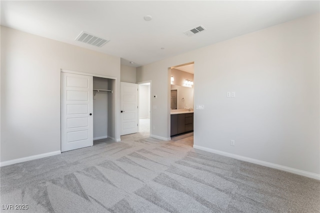 1801 Flycatch St, Las Vegas, NV 89138 - unfurnished bedroom with light colored carpet, a closet, and ensuite bath