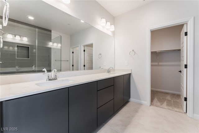 1801 Flycatch St, Las Vegas, NV 89138 - bathroom with double vanity, a walk in closet, and tile patterned flooring