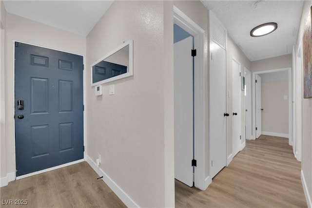 3509 Navajo Way, Las Vegas, NV 89108 - corridor featuring light wood-type flooring and baseboards