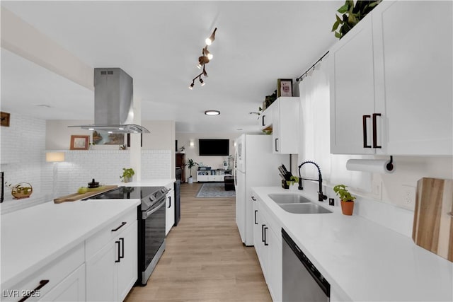 3509 Navajo Way, Las Vegas, NV 89108 - kitchen featuring island exhaust hood, dishwasher, range with electric cooktop, and light countertops