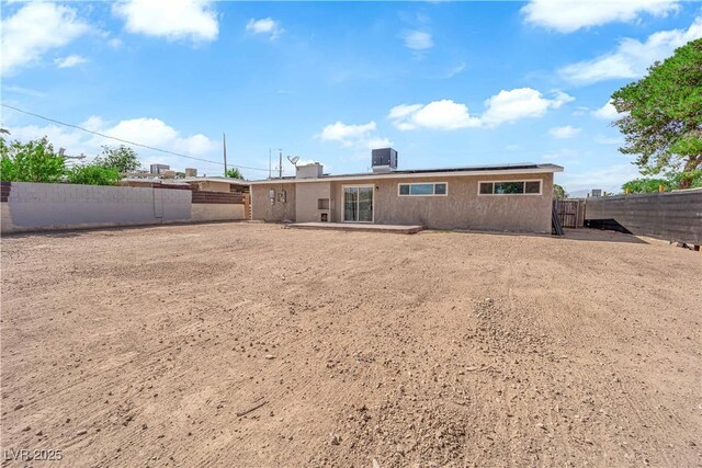 3509 Navajo Way, Las Vegas, NV 89108 - back of house with roof mounted solar panels, a fenced backyard, and a patio