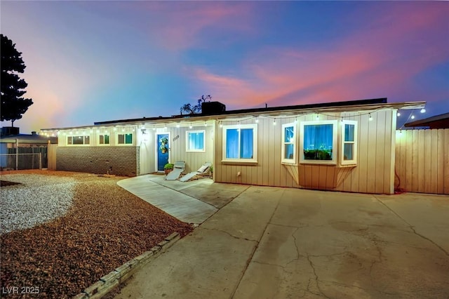 3509 Navajo Way, Las Vegas, NV 89108 - view of front facade with board and batten siding and a patio area