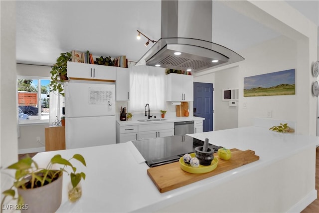 3509 Navajo Way, Las Vegas, NV 89108 - kitchen featuring island range hood, freestanding refrigerator, white cabinetry, dishwasher, and light countertops