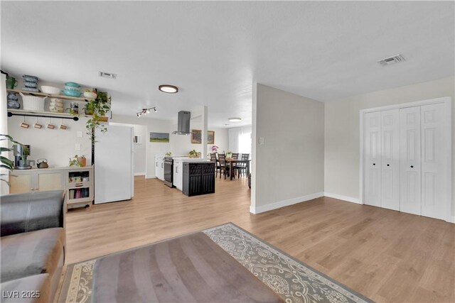 3509 Navajo Way, Las Vegas, NV 89108 - living area featuring light wood-type flooring and baseboards