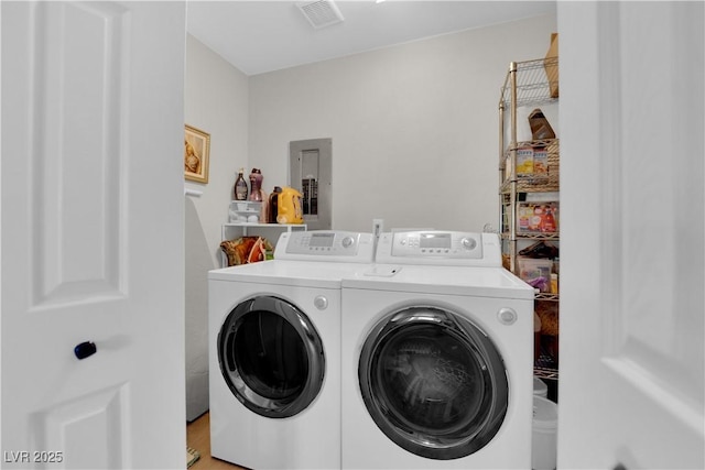 3509 Navajo Way, Las Vegas, NV 89108 - laundry area featuring electric panel and washing machine and clothes dryer