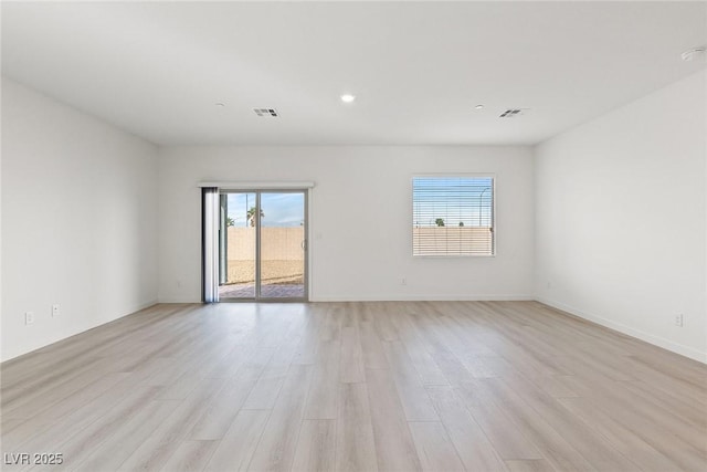2721 Avril Point St, Las Vegas, NV 89156 - empty room with light wood-style flooring and recessed lighting