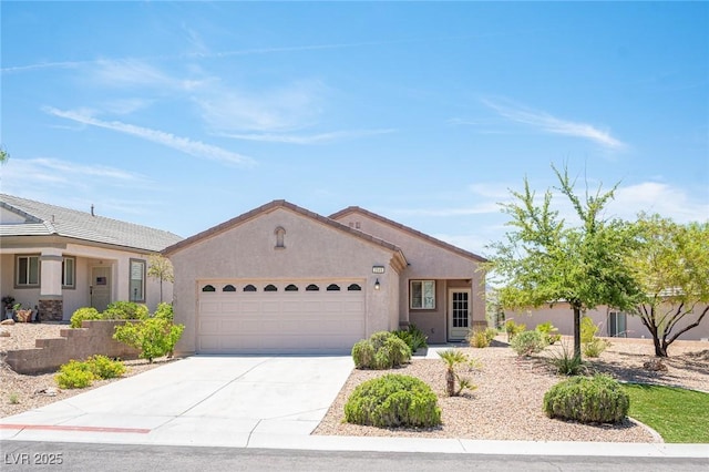 2545 Divine Sky Dr, Henderson, NV 89044 - view of front facade featuring an attached garage, concrete driveway, and stucco siding