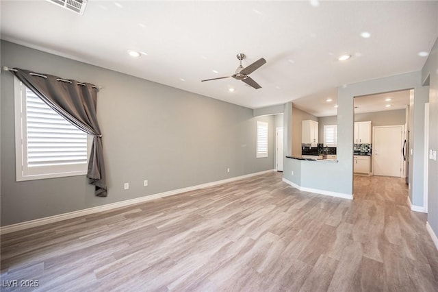 2545 Divine Sky Dr, Henderson, NV 89044 - unfurnished living room featuring ceiling fan, light wood finished floors, and recessed lighting