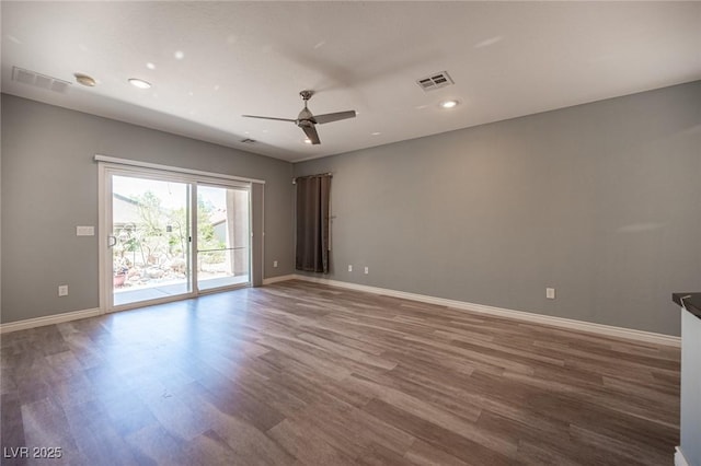 2545 Divine Sky Dr, Henderson, NV 89044 - empty room with wood finished floors, ceiling fan, and recessed lighting