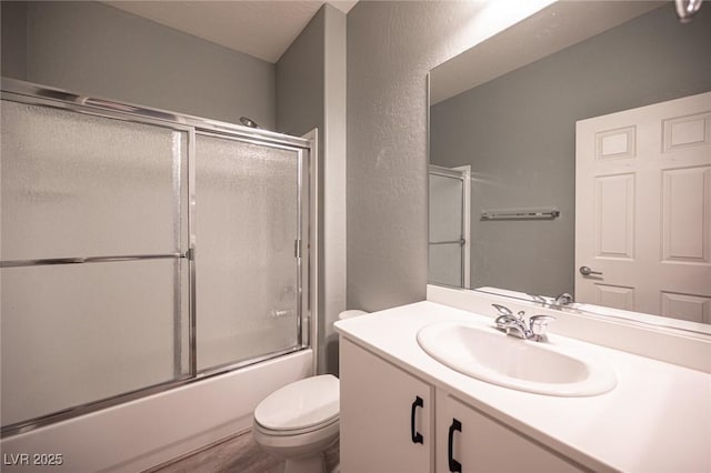 2545 Divine Sky Dr, Henderson, NV 89044 - full bathroom with vanity, shower / bath combination with glass door, and a textured wall