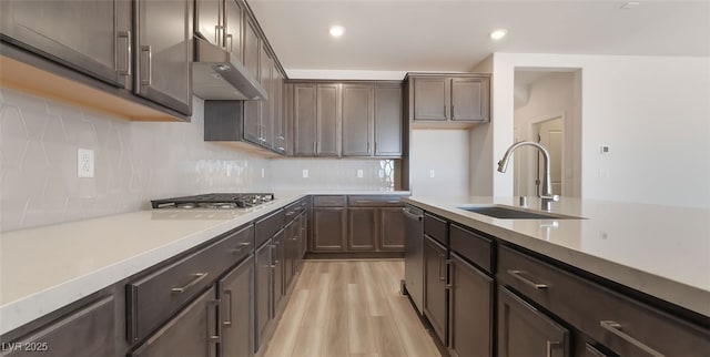765 Cloud Creek St, Henderson, NV 89011 - kitchen with stainless steel appliances, under cabinet range hood, light wood-style flooring, light countertops, and recessed lighting