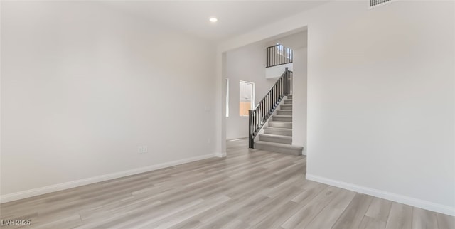 765 Cloud Creek St, Henderson, NV 89011 - spare room featuring light wood finished floors, stairway, and recessed lighting