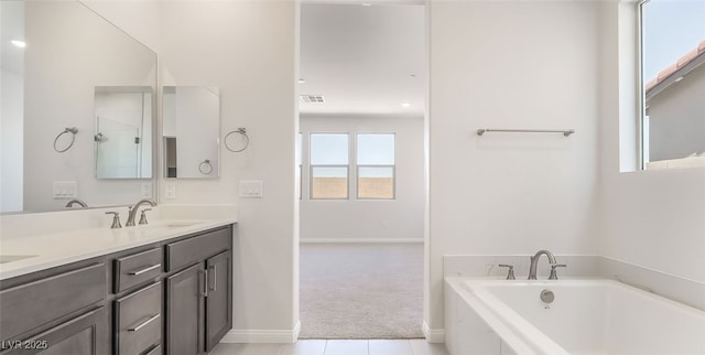 765 Cloud Creek St, Henderson, NV 89011 - full bathroom featuring a garden tub, double vanity, and tile patterned floors