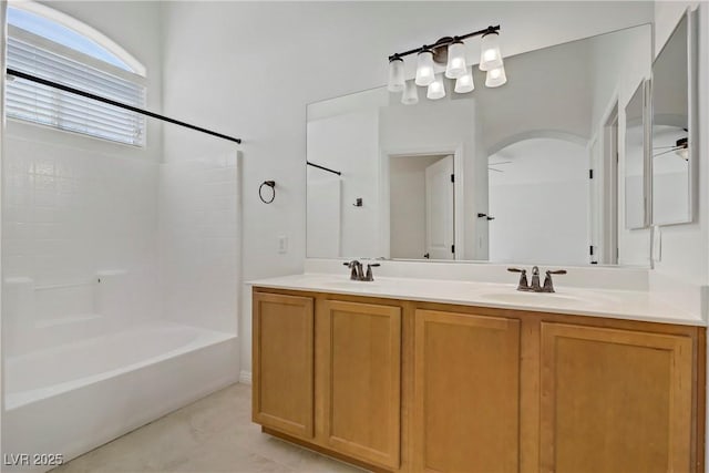 10062 Aspen Rose St Unit 103, Las Vegas, NV 89183 - bathroom featuring double vanity and washtub / shower combination