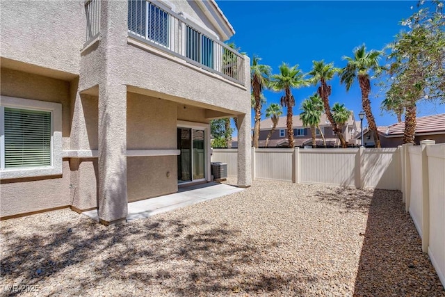 10062 Aspen Rose St Unit 103, Las Vegas, NV 89183 - fenced backyard featuring a balcony