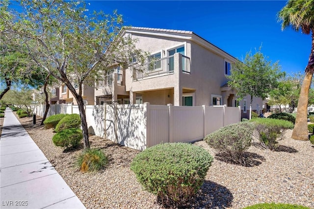 10062 Aspen Rose St Unit 103, Las Vegas, NV 89183 - view of side of home with stucco siding