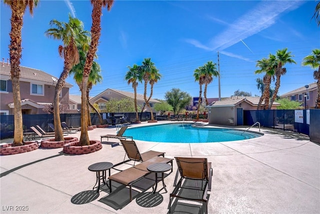 10062 Aspen Rose St Unit 103, Las Vegas, NV 89183 - community pool with a patio area and a residential view