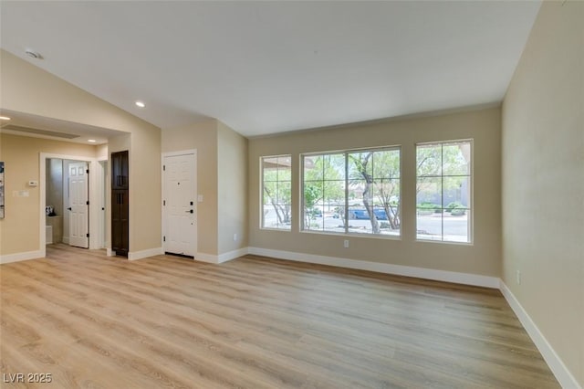 9800 Rosamond Dr, Las Vegas, NV 89134 - unfurnished living room with lofted ceiling, light wood finished floors, and recessed lighting