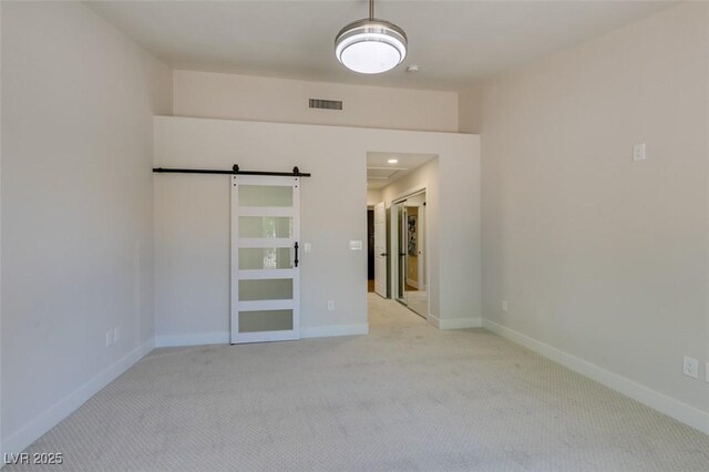 9800 Rosamond Dr, Las Vegas, NV 89134 - spare room featuring carpet floors and a barn door