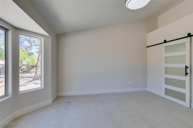 9800 Rosamond Dr, Las Vegas, NV 89134 - empty room with a barn door and light carpet