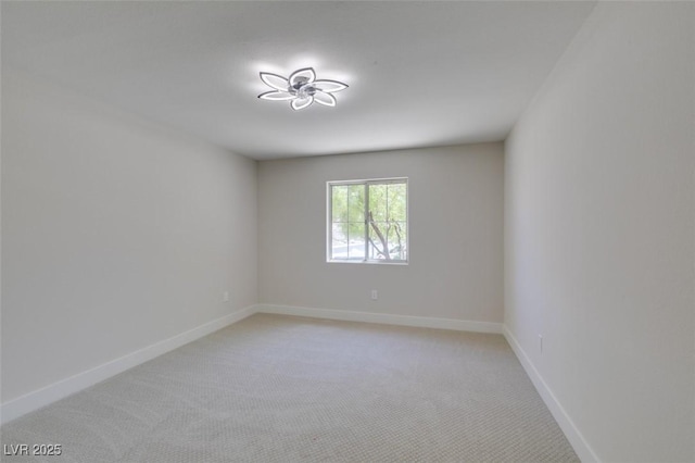 9800 Rosamond Dr, Las Vegas, NV 89134 - unfurnished room featuring light colored carpet and baseboards