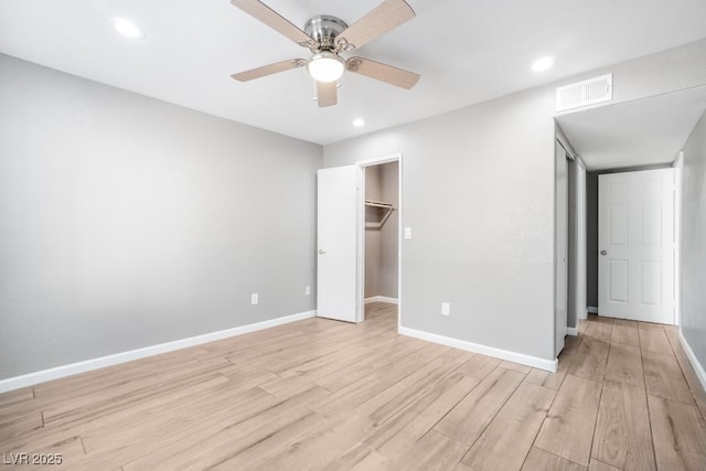 5000 Red Rock St Unit 120, Las Vegas, NV 89118 - unfurnished bedroom featuring light wood-type flooring, recessed lighting, a ceiling fan, and a walk in closet