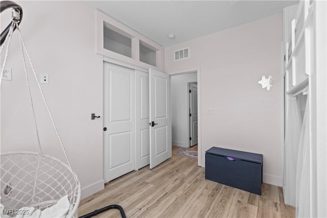 3369 Ponicelli Ln, Henderson, NV 89044 - unfurnished bedroom featuring light wood finished floors and a closet
