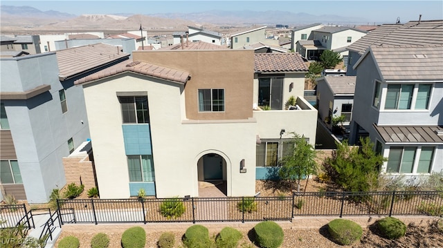 3369 Ponicelli Ln, Henderson, NV 89044 - view of front facade featuring stucco siding, a residential view, a tile roof, and a mountain view