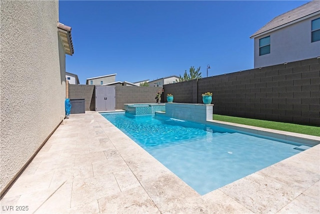 3369 Ponicelli Ln, Henderson, NV 89044 - view of pool with a fenced backyard, a pool with connected hot tub, and a patio