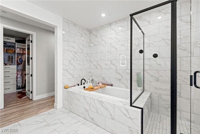 3369 Ponicelli Ln, Henderson, NV 89044 - full bath featuring a bath, marble finish flooring, a shower stall, a spacious closet, and recessed lighting