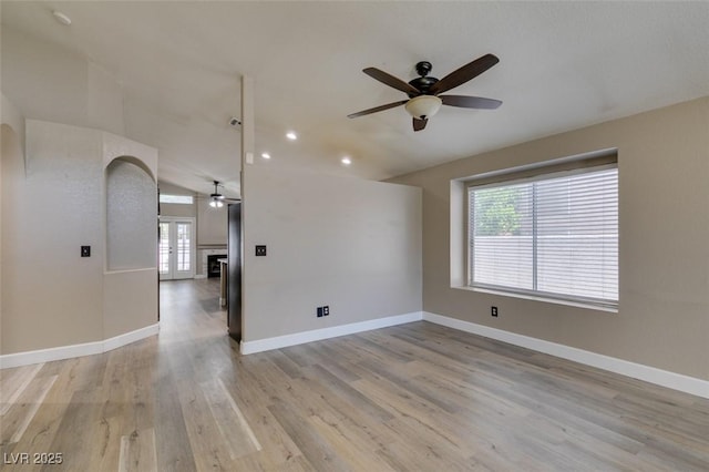 87 Ginger Lily Ter, Henderson, NV 89074 - empty room with a ceiling fan, healthy amount of natural light, light wood finished floors, recessed lighting, and vaulted ceiling