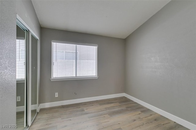 87 Ginger Lily Ter, Henderson, NV 89074 - spare room featuring wood finished floors and baseboards