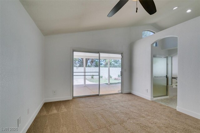 87 Ginger Lily Ter, Henderson, NV 89074 - carpeted spare room featuring vaulted ceiling, ceiling fan, plenty of natural light, and arched walkways